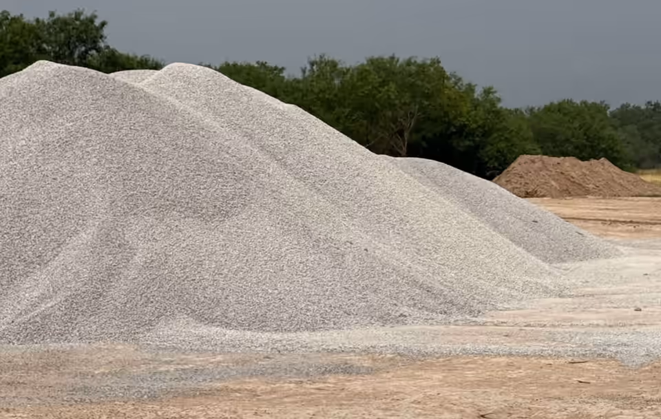 Stockpile of 57 stone aggregate ready for drainage and utility installation in South Texas